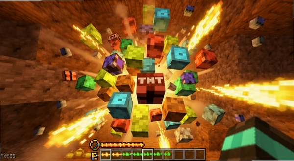 Minecraft Blast 爆破特效展示图,画面中央为大量彩色像素方块被TNT炸开的瞬间,碎片向四周飞溅,火光与烟雾效果明显,底部有能量条充能特效,背景是洞穴岩壁纹理,整体色调偏暖橙与亮黄,3D卡通渲染风格,画面主体坐标居中,背景区域为地下矿洞。