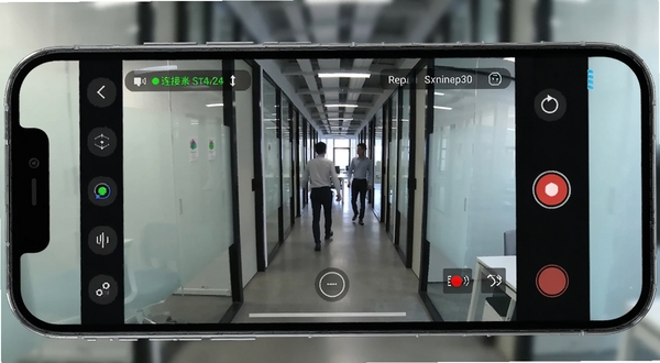 Camera Monitor 实时画面预览功能展示,手机横屏显示监控画面,画面中为办公室走廊场景,有人员在走动,屏幕边缘显示连接状态与录制按钮,科技感界面设计,适配Boogu模型生成