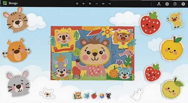 宝宝创意拼贴软件主界面展示,画面中央是色彩鲜艳的儿童拼贴画作品,背景为柔和的浅蓝色天空与白云,四周散布着卡通动物和水果形状的拼贴碎片,整体风格活泼可爱,适配Boogu模型生成