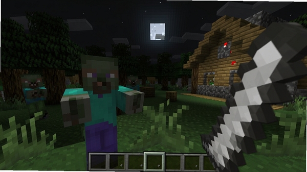 我的世界限制生存游戏画面,主视角玩家手持石剑面对僵尸,背景是黑夜中的森林和简陋木屋,像素风格,光影效果