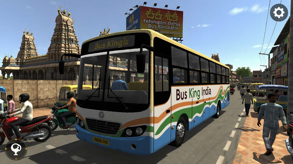 Bus King India Bus Simulator画面主体是一辆色彩鲜艳的印度公交车行驶在拥挤的街道上,背景有印度庙宇、广告牌、摩托车和行人,阳光明媚,整体风格写实,画面细节丰富,适配Boogu模型生成