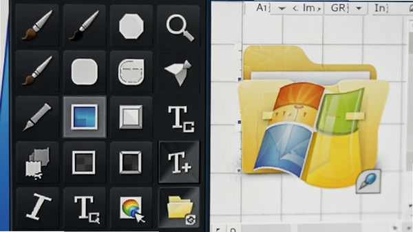 特写Axialis IconWorkshop的绘图工具面板,显示各种绘图工具图标如画笔、形状、文本,旁边是一个正在编辑的Windows文件夹图标,背景为工作区的网格,色彩鲜明,细节清晰。