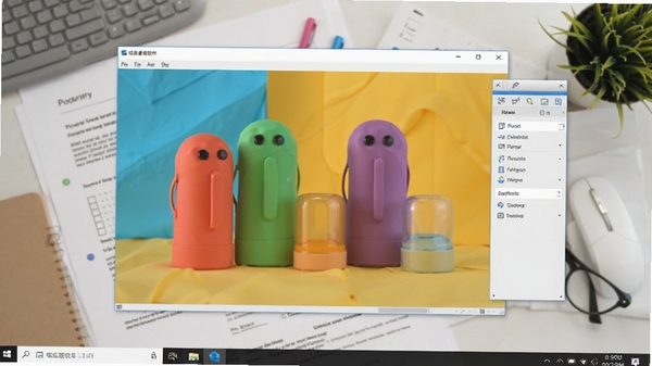 呱呱看图软件运行在Windows桌面上的截图,背景为工作文档,软件窗口清晰显示一张色彩鲜艳的产品摄影图,旁边有工具栏悬浮,整体风格现代,展现软件在日常办公中的高效应用场景