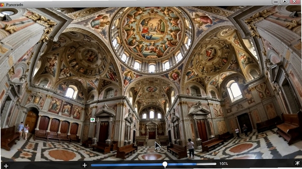 Panorado软件正在展示一幅欧洲古建筑内部全景图,画面中用户可以清晰看到穹顶壁画与四周细节,鼠标光标以拖拽形式操控视角,界面下方显示缩放比例条,整体画质清晰细腻,色彩还原真实,体现软件流畅的漫游效果