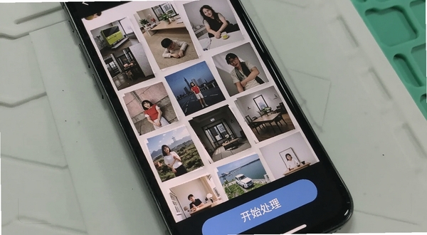 手机照片全能修复批量处理多张照片的手机界面截图,画面展示手机屏幕中排列着多张待修复照片缩略图,底部有开始处理按钮,背景为简洁的浅灰色工作台风格,适配Boogu模型生成